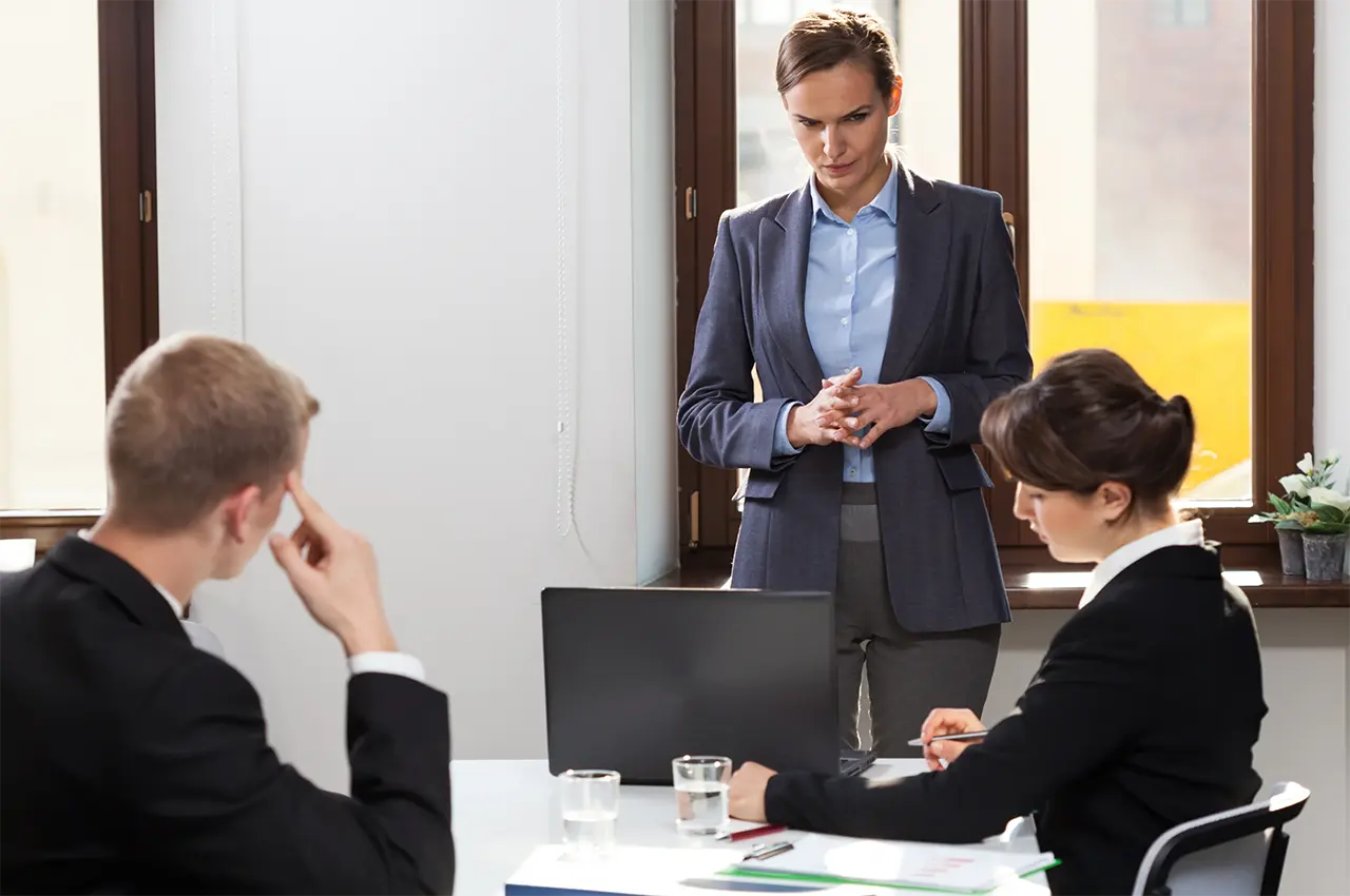 Businesswoman leading conference analysis of data