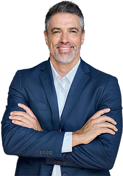 Contact Patra Now Businessman smiling arms crossed