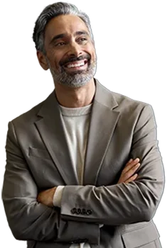 Contact Patra Now Businessman smiling arms crossed