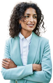 Contact Patra Today! contact image woman smiling, standing facing right with arms crossed pale turquoise jacket