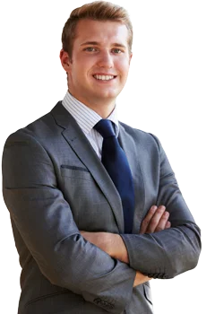 Contact Patra Now Young businessman smiling arms crossed